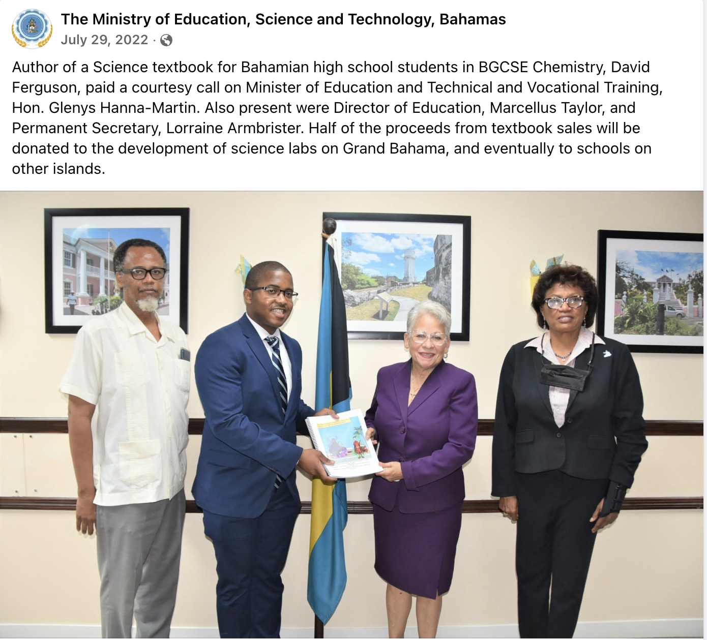 David Ferguson presenting his chemistry textbook to Hon. Glenys Hanna-Martin, Minister of Education, and Ministry officials